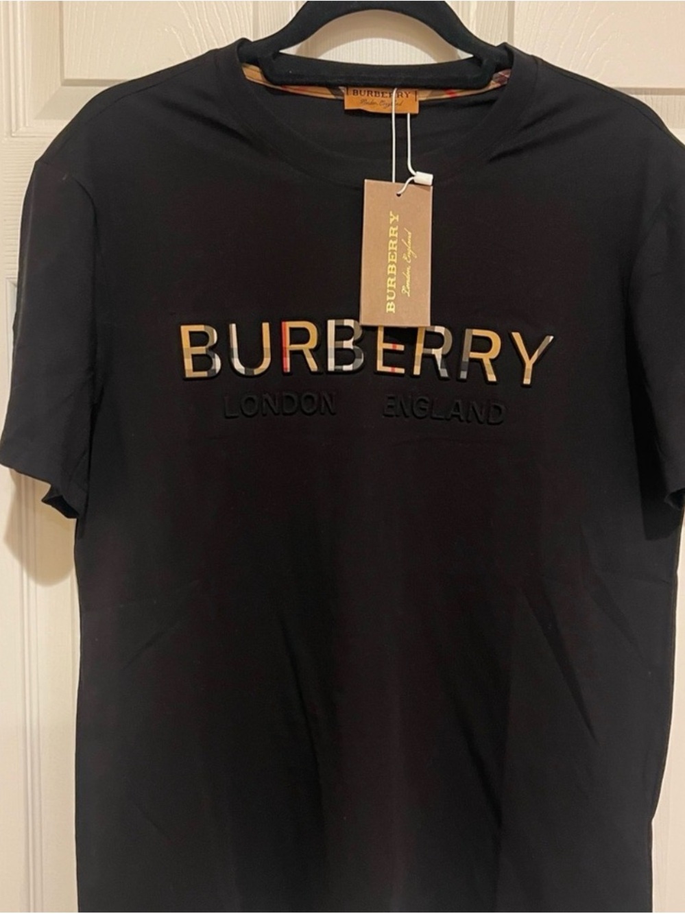 Burberry Black Tee with Gold Lettering and Multicolor Accent